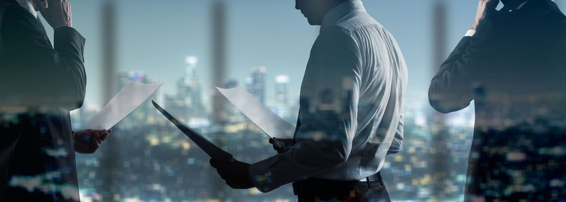 men in suits with city backdrop