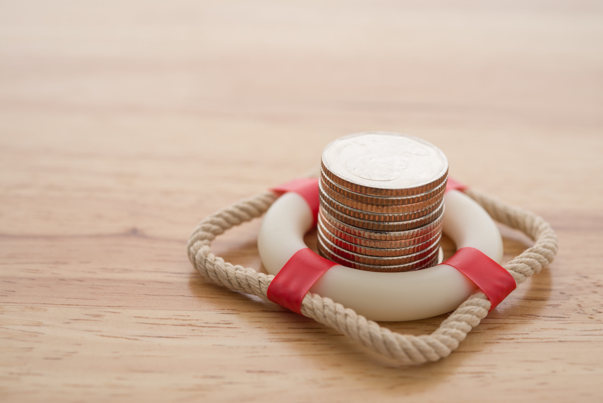 Stack of coins in red lifering .