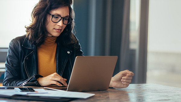 business woman looking at laptop