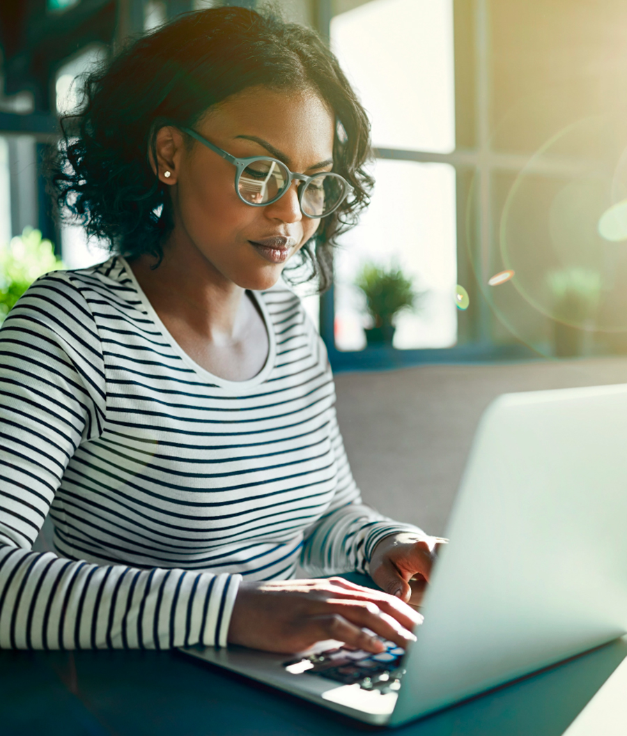 business woman typing on laptop