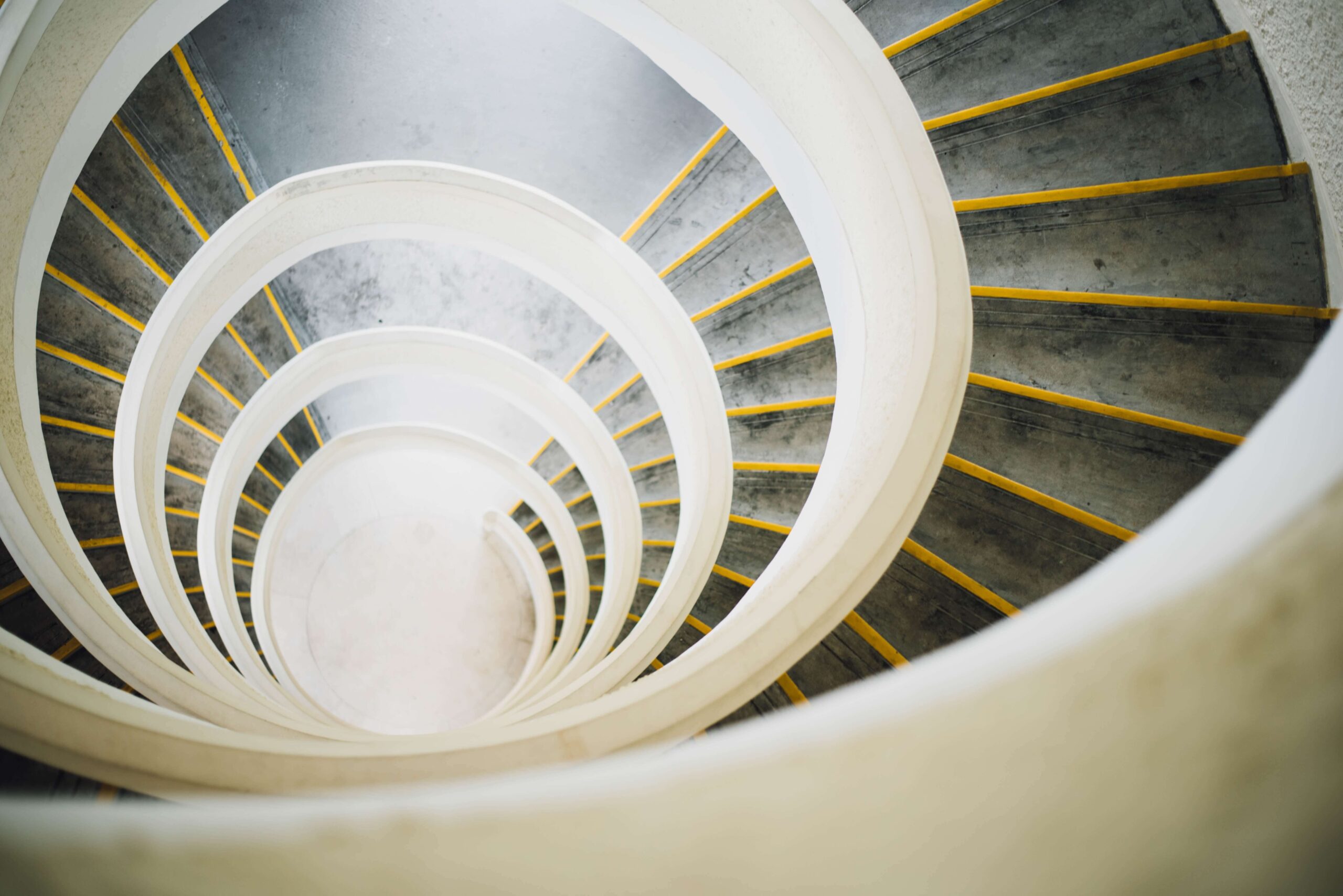 spiral staircase representing falling inflation