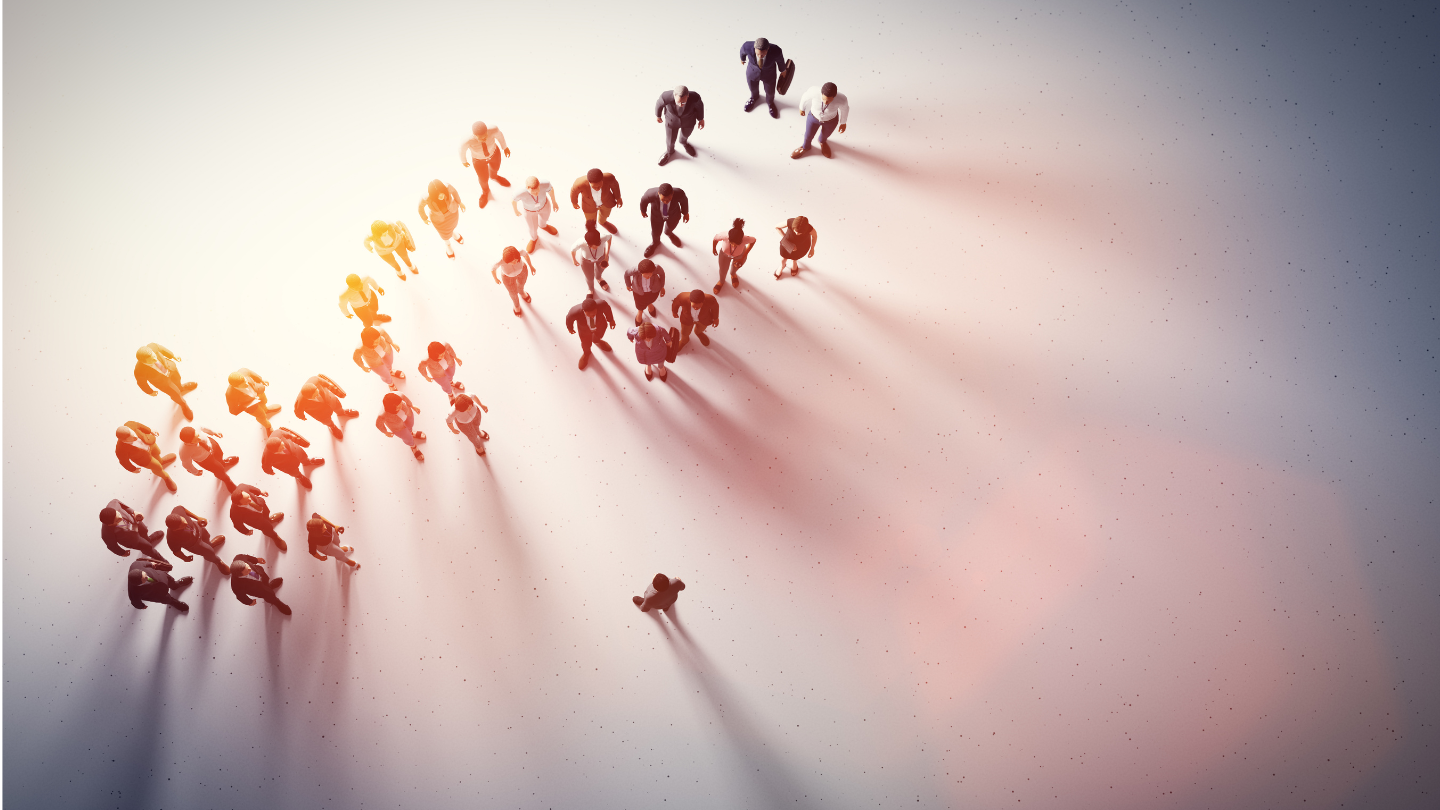 A group of people standing in front of one person - suggesting a workforce being spoken to by their employer