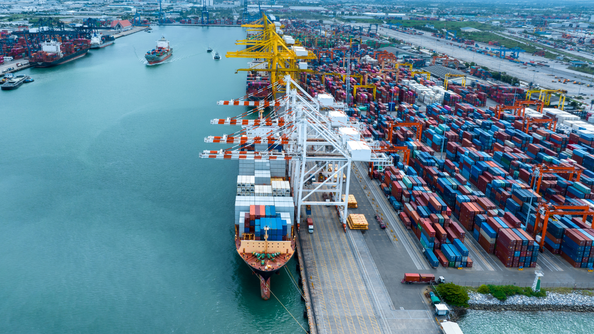Image of a shipping container port with cranes